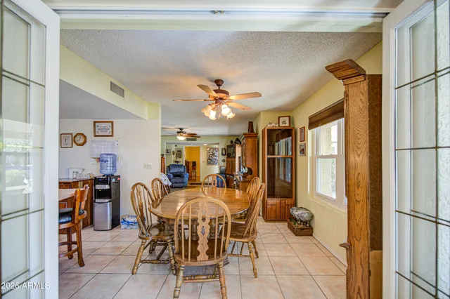 a dining room with furniture and window