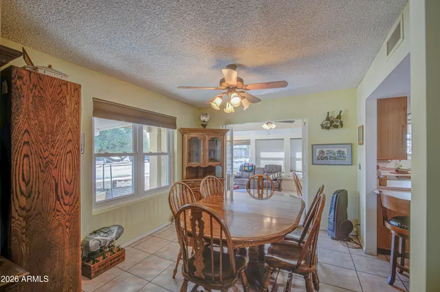 a view of a dining room with furniture window and outside view