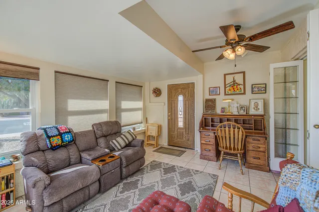 a living room with furniture and a window