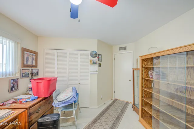 a bedroom with furniture and a window