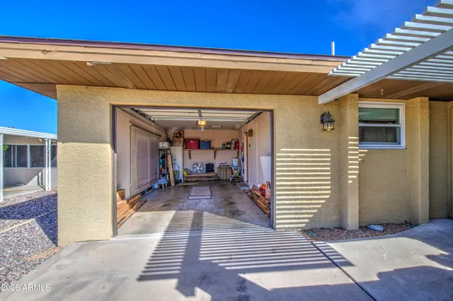 a view of a backyard with plants and a patio