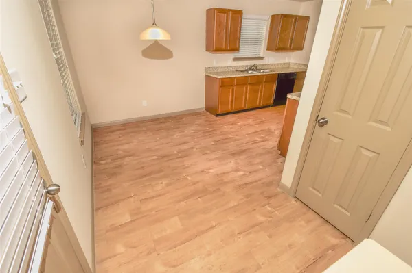 a view of front door with washer and dryer