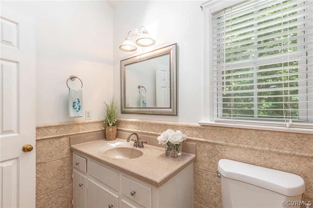 4542 Little Ridge Lane Chesterfield, VA 23832 - Photo 19 of 40 a bathroom with a toilet sink and mirror