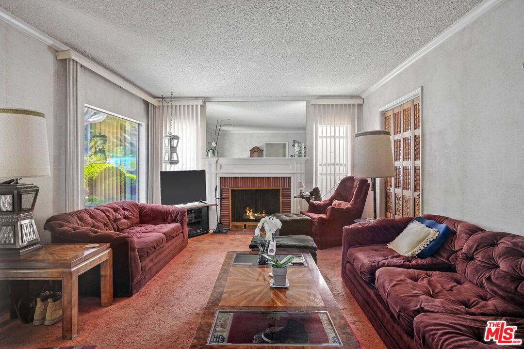 1334 Pine Street Santa Monica, CA 90405 - Photo 4 of 9 a living room with furniture fireplace and a window
