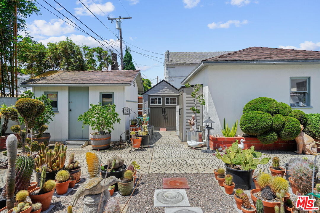 1334 Pine Street Santa Monica, CA 90405 - Photo 8 of 9 a front view of a house with lots of potted plants