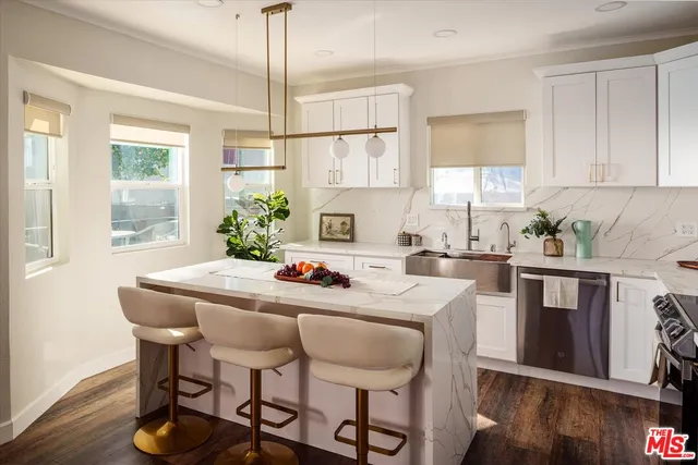 a living room with furniture lamp and window
