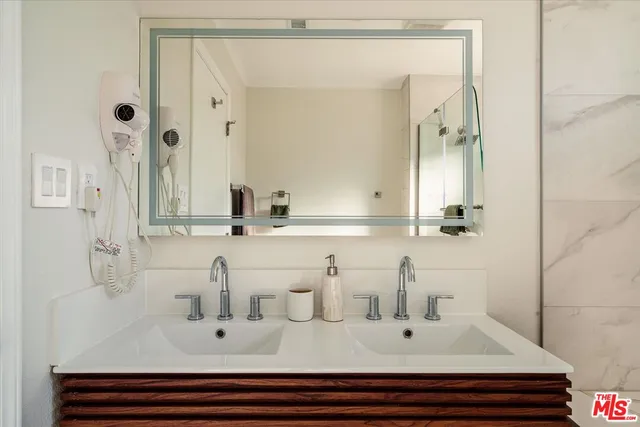 a bedroom with furniture and a wooden floor