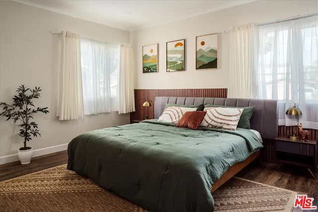 a bathroom with a sink toilet vanity and shower