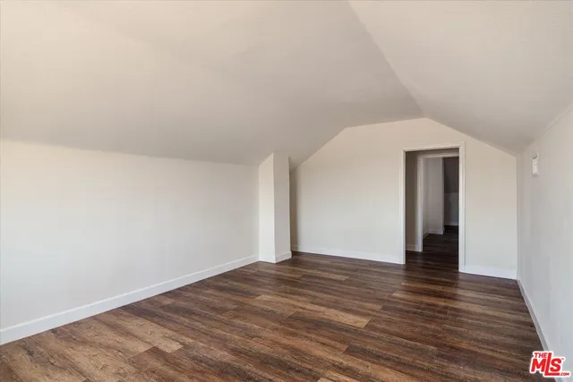 a view of washer and dryer with wooden floor