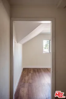 a view of a chairs and table in the balcony
