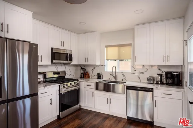 an aerial view of a house with a swimming pool
