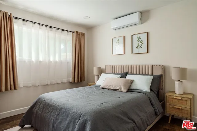 a view of a yard with plants and trees