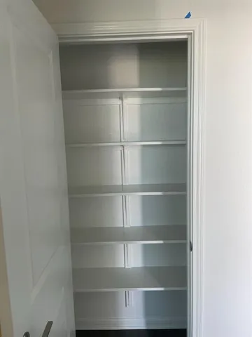 a view of an empty room with empty racks