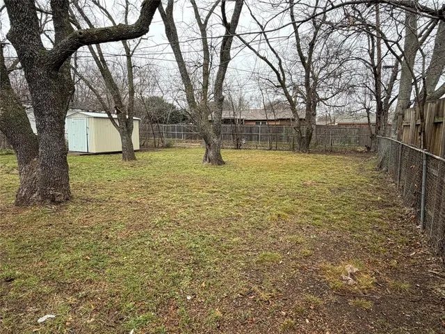 a view of backyard with outdoor space