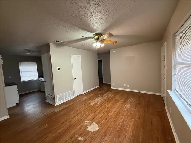 a kitchen with stainless steel appliances a stove a sink and a microwave