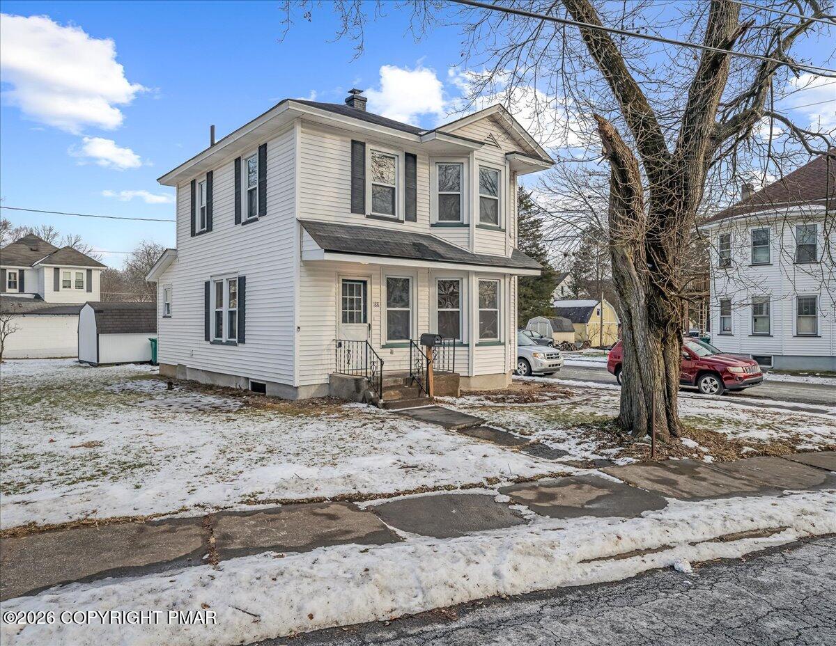 a front view of a house with a yard