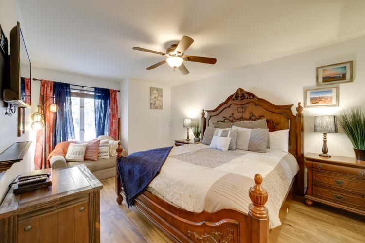 591 Golden Creek Road, Unit 591 Mammoth Lakes, CA 93546 - Photo 12 of 19 a bedroom with a bed and wooden floor