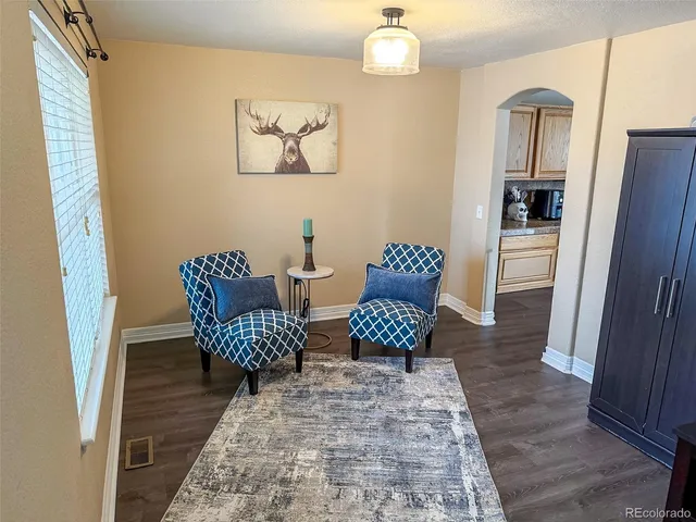 a view of a hallway with seating area