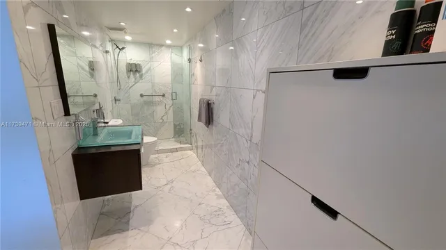 a room with lots of chairs and mirrors