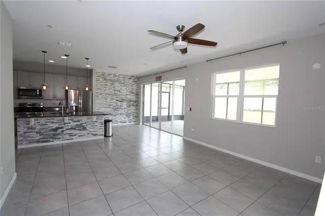 a view of a electric appliances and a window in a room