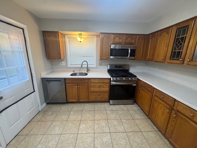 26 Albertson Road Hamden, CT 06514 - Photo 13 of 38 a kitchen with a sink a stove top oven and cabinets