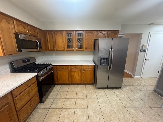 26 Albertson Road Hamden, CT 06514 - Photo 14 of 38 a kitchen with stainless steel appliances granite countertop a refrigerator a stove top oven and a sink