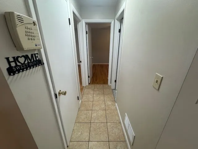 a view of an entryway with a mirror