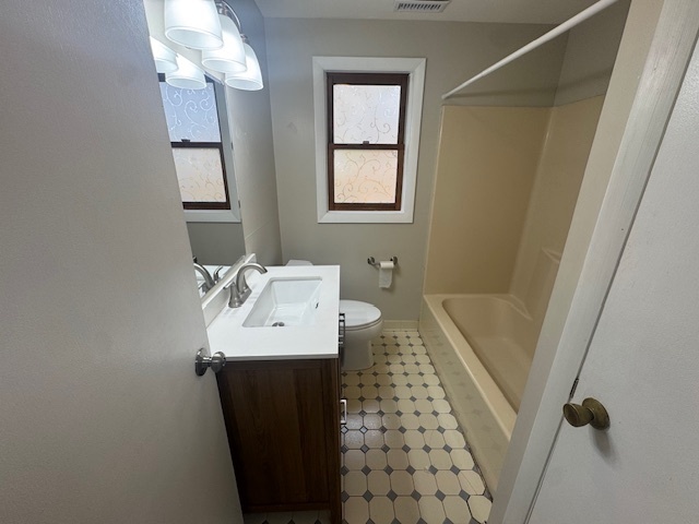 26 Albertson Road Hamden, CT 06514 - Photo 34 of 38 a bathroom with a sink and mirror with toilet