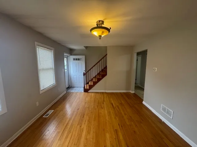 a view of an entryway with wooden floor