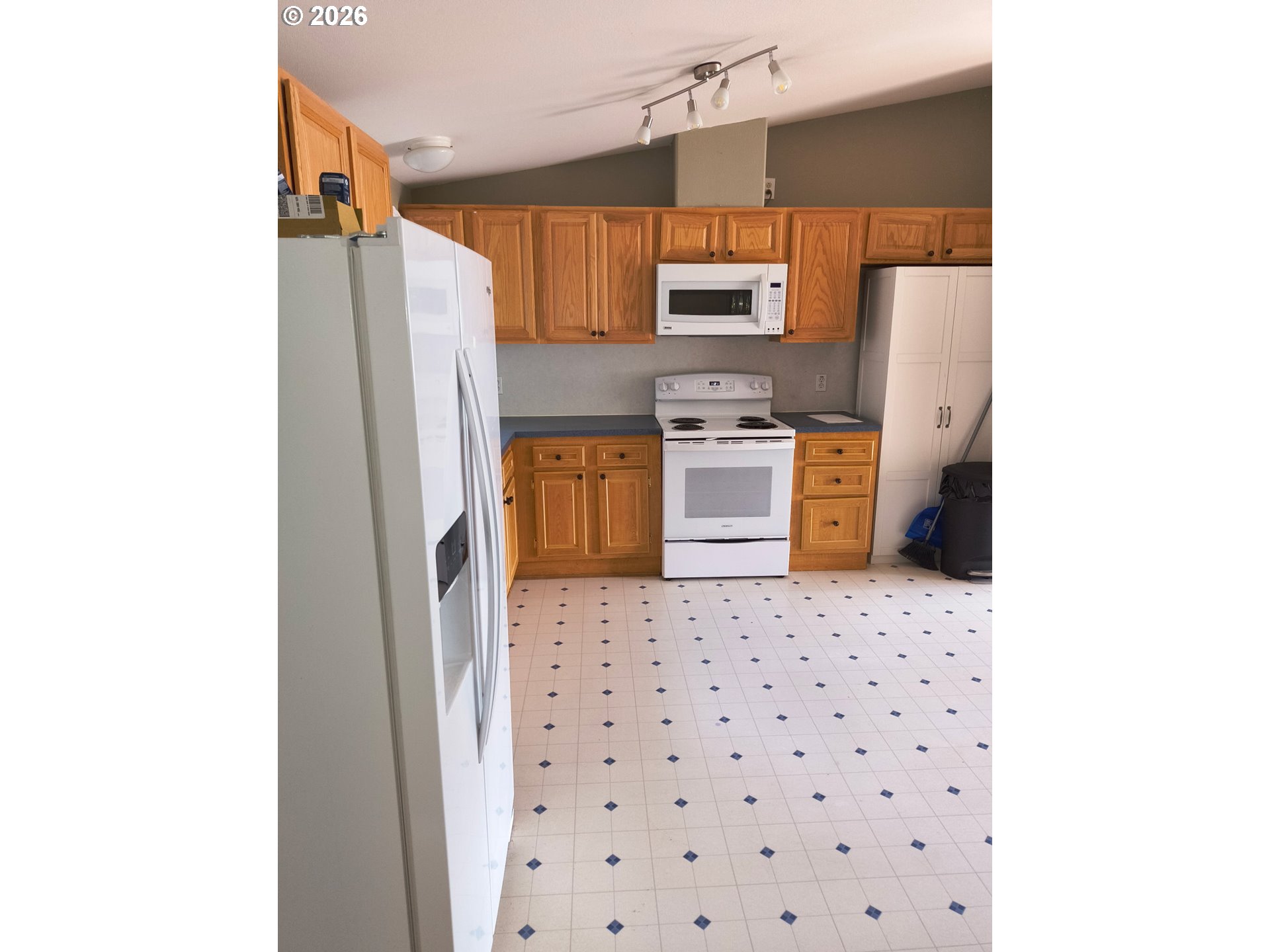 34900 Wendlandt Way, Unit F Scappoose, OR 97056 - Photo 13 of 19 a kitchen with stainless steel appliances a refrigerator and a stove