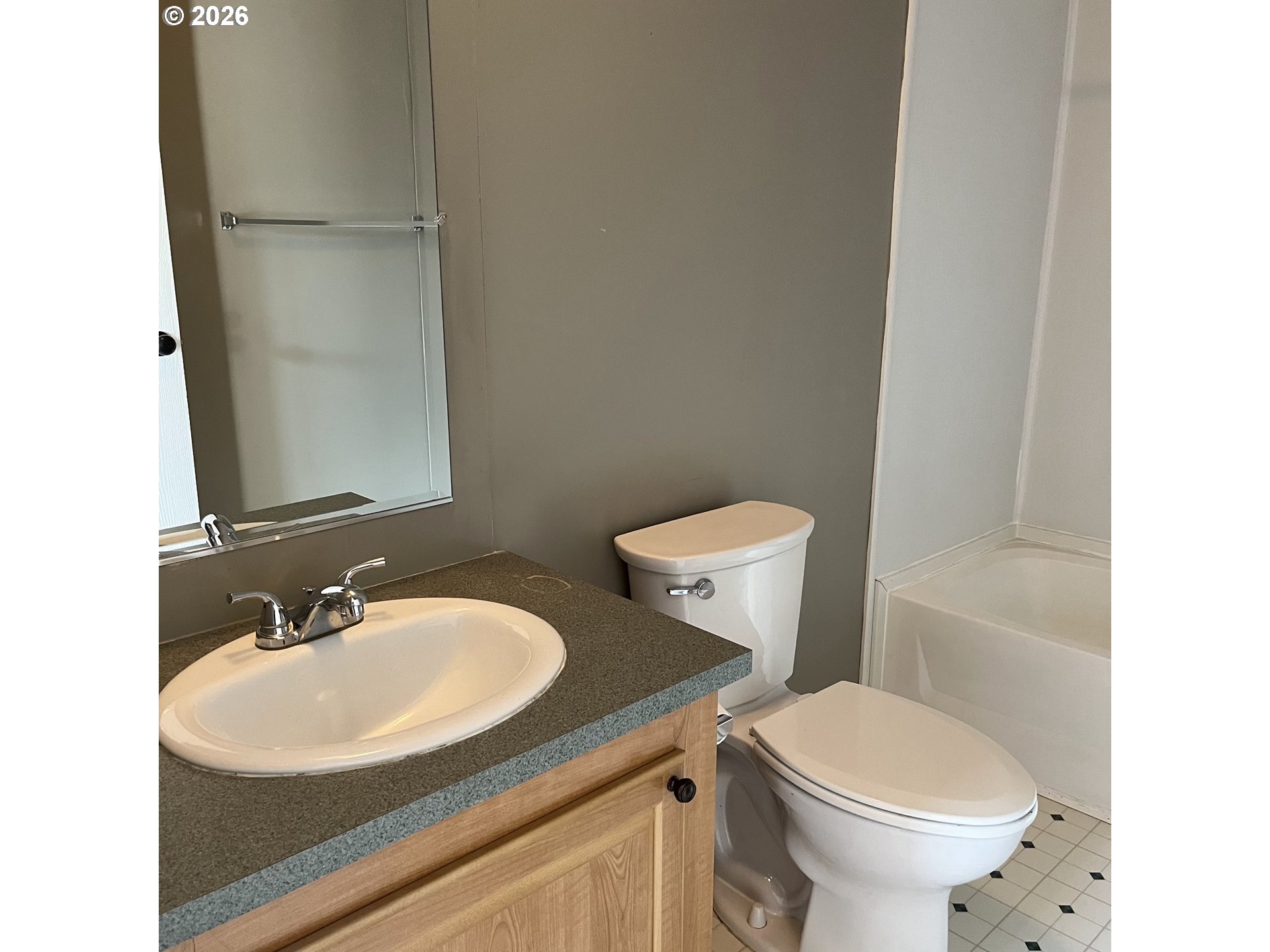 34900 Wendlandt Way, Unit F Scappoose, OR 97056 - Photo 16 of 19 a bathroom with a sink toilet and a mirror
