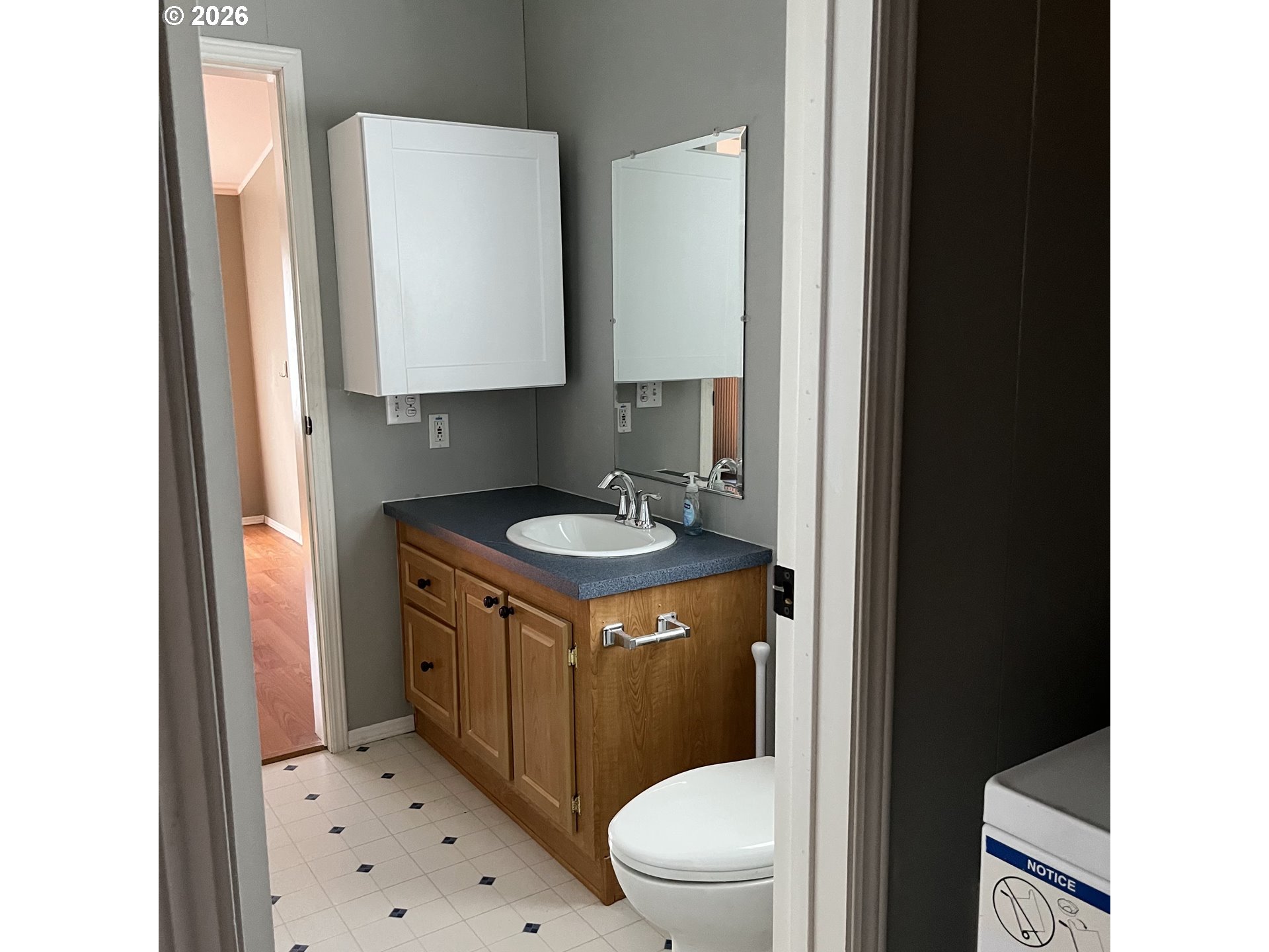 34900 Wendlandt Way, Unit F Scappoose, OR 97056 - Photo 17 of 19 a bathroom with a sink toilet and a mirror