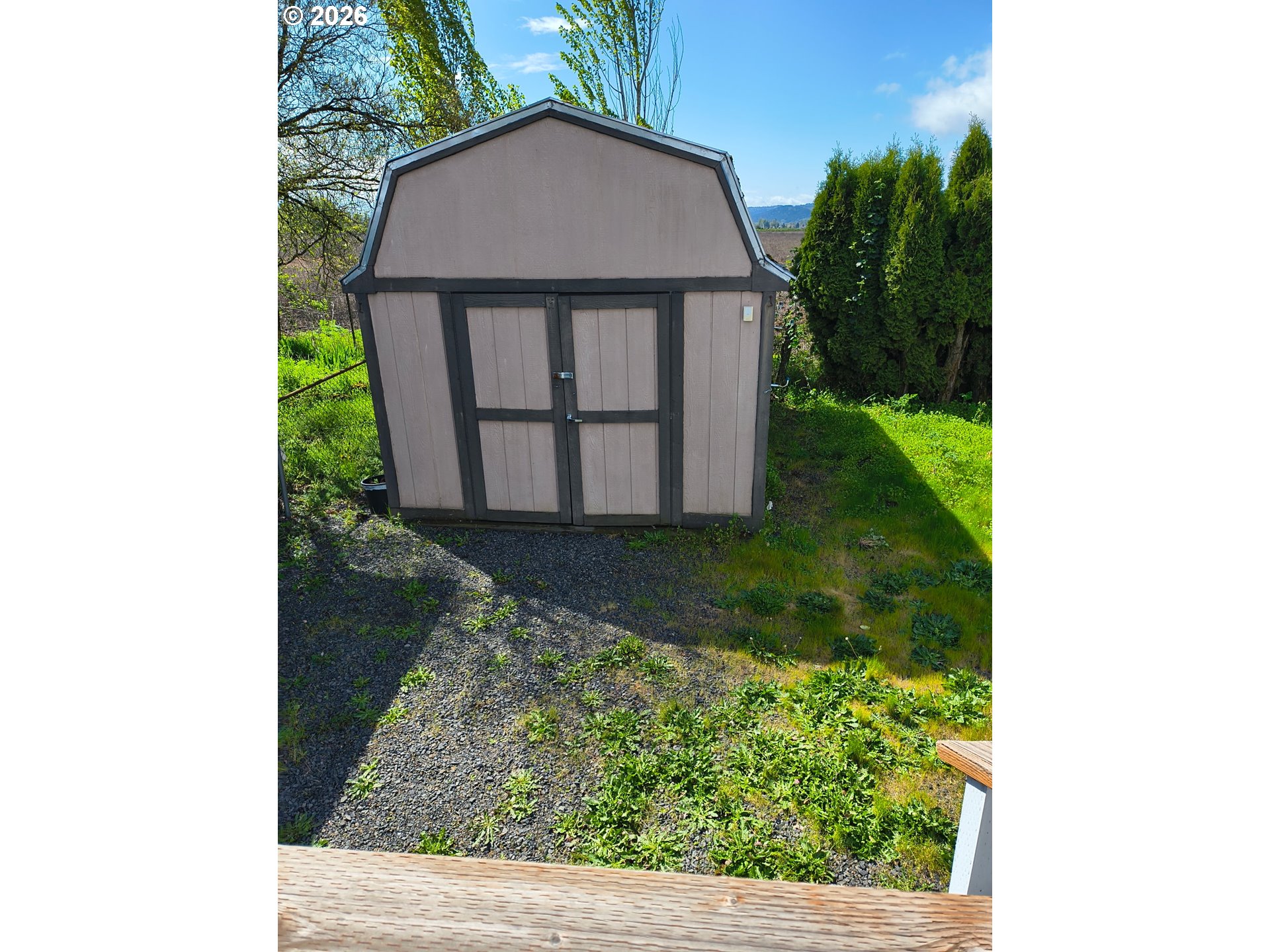 34900 Wendlandt Way, Unit F Scappoose, OR 97056 - Photo 18 of 19 a view of a backyard with potted plants