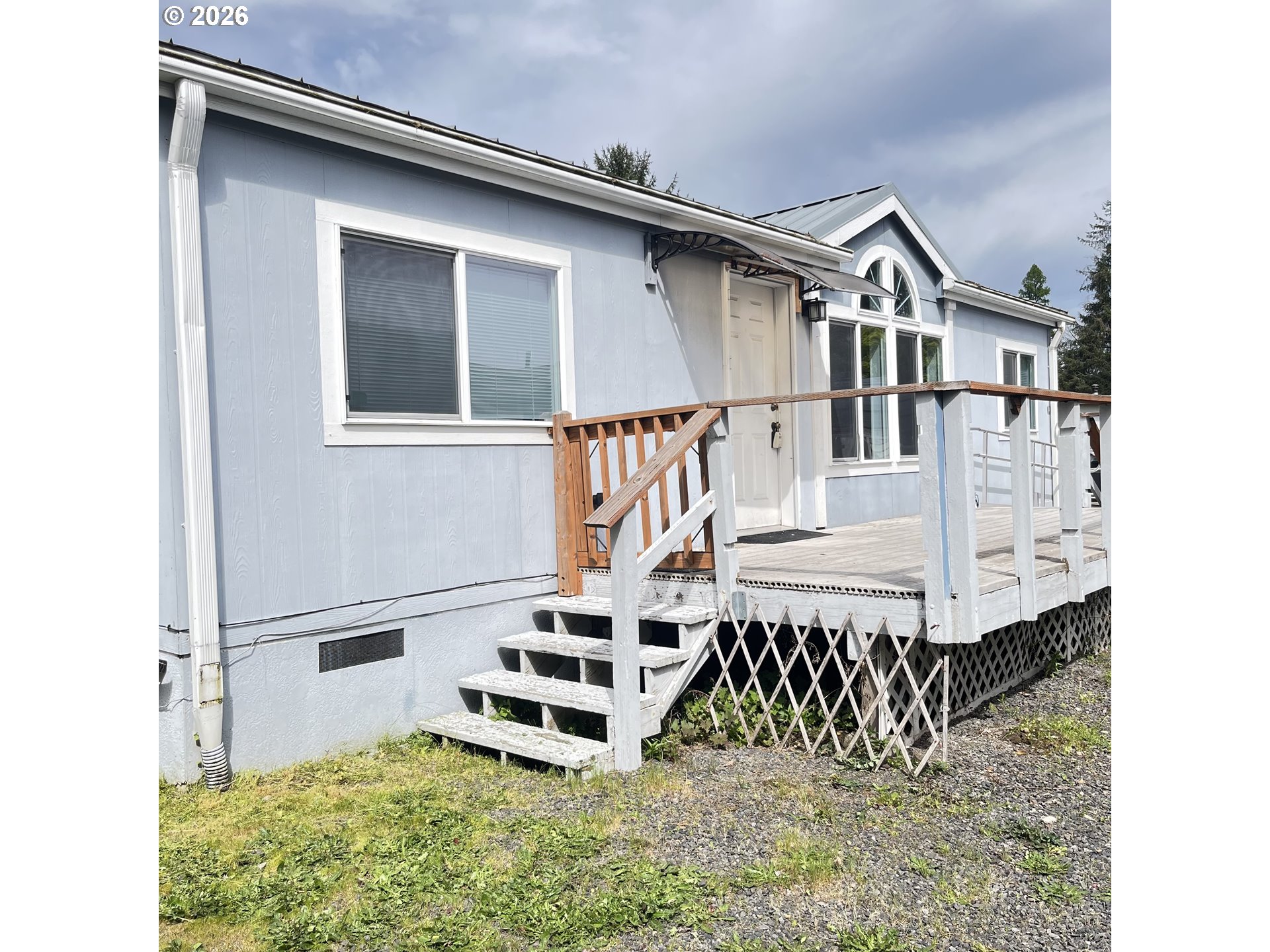 34900 Wendlandt Way, Unit F Scappoose, OR 97056 - Photo 2 of 19 a view of a house with a small deck