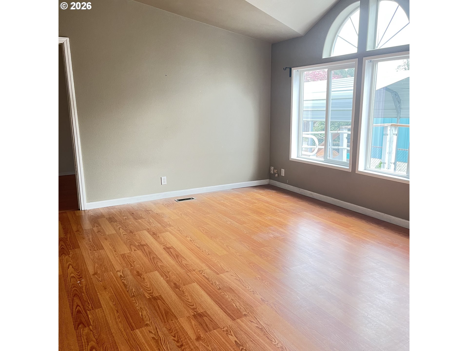 34900 Wendlandt Way, Unit F Scappoose, OR 97056 - Photo 5 of 19 a view of empty room with wooden floor and fan