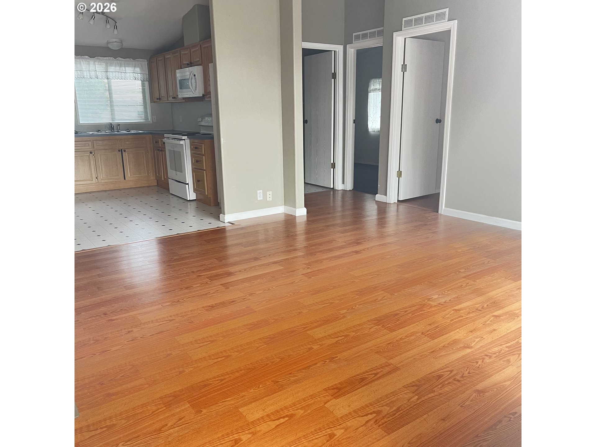34900 Wendlandt Way, Unit F Scappoose, OR 97056 - Photo 7 of 19 a view of an empty room with a window