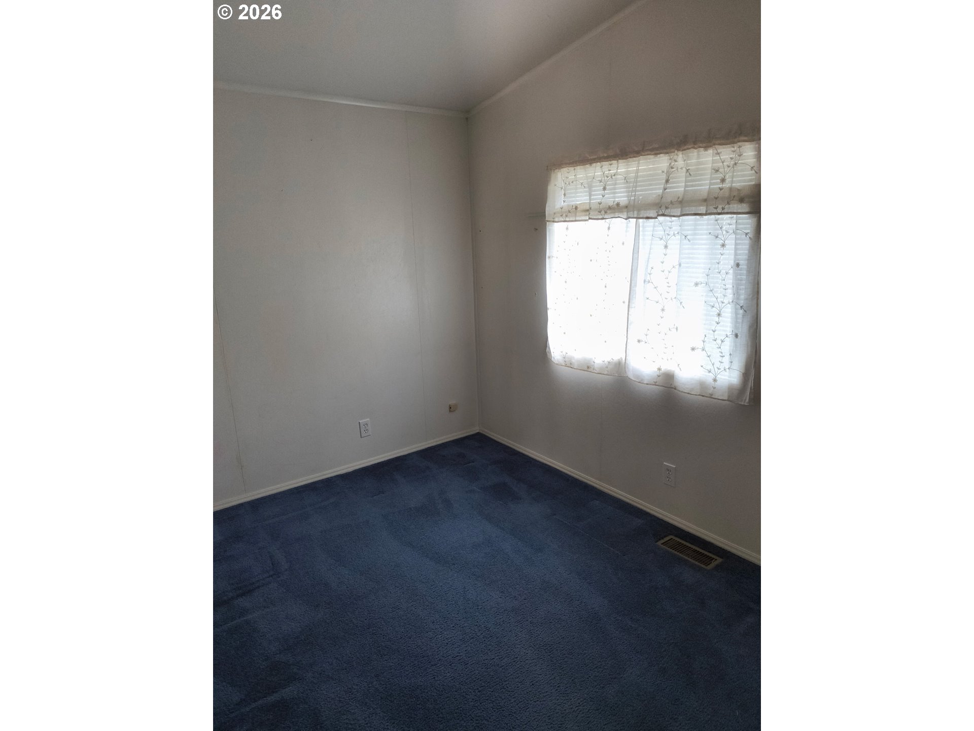 34900 Wendlandt Way, Unit F Scappoose, OR 97056 - Photo 9 of 19 a view of an empty room and window