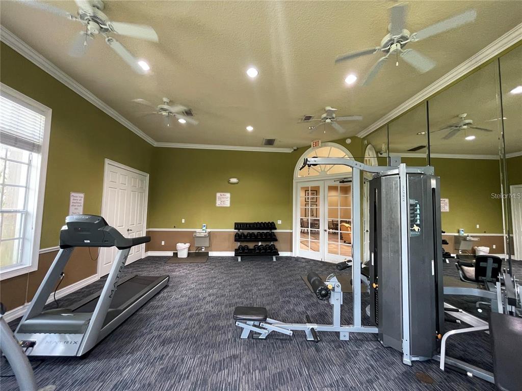 3577 Wilshire Way Road, Unit 61 Orlando, FL 32829 - Photo 18 of 19 a living room with furniture gym equipment and a view of living room