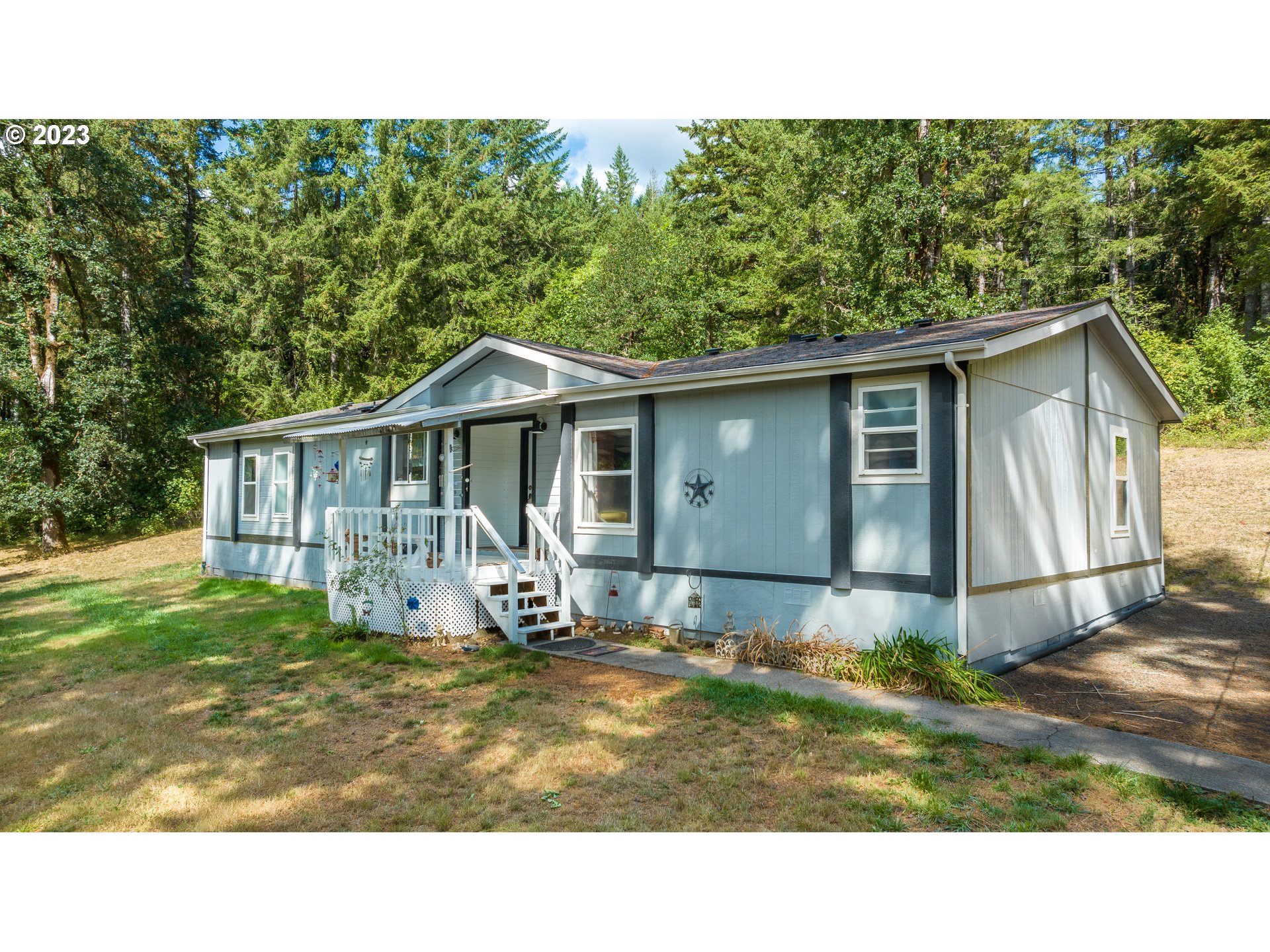 22575 Southwest Grand Ronde Road Grand Ronde, OR 97347 - Photo 1 of 46 a house view with a garden space