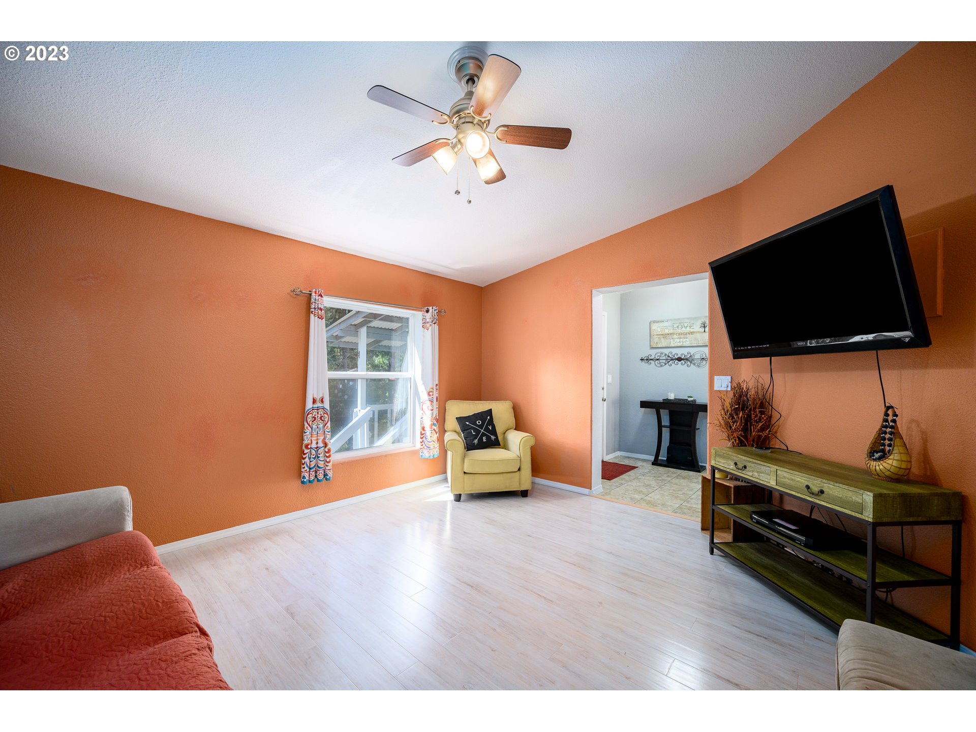 22575 Southwest Grand Ronde Road Grand Ronde, OR 97347 - Photo 23 of 46 a bedroom with furniture and a flat screen tv