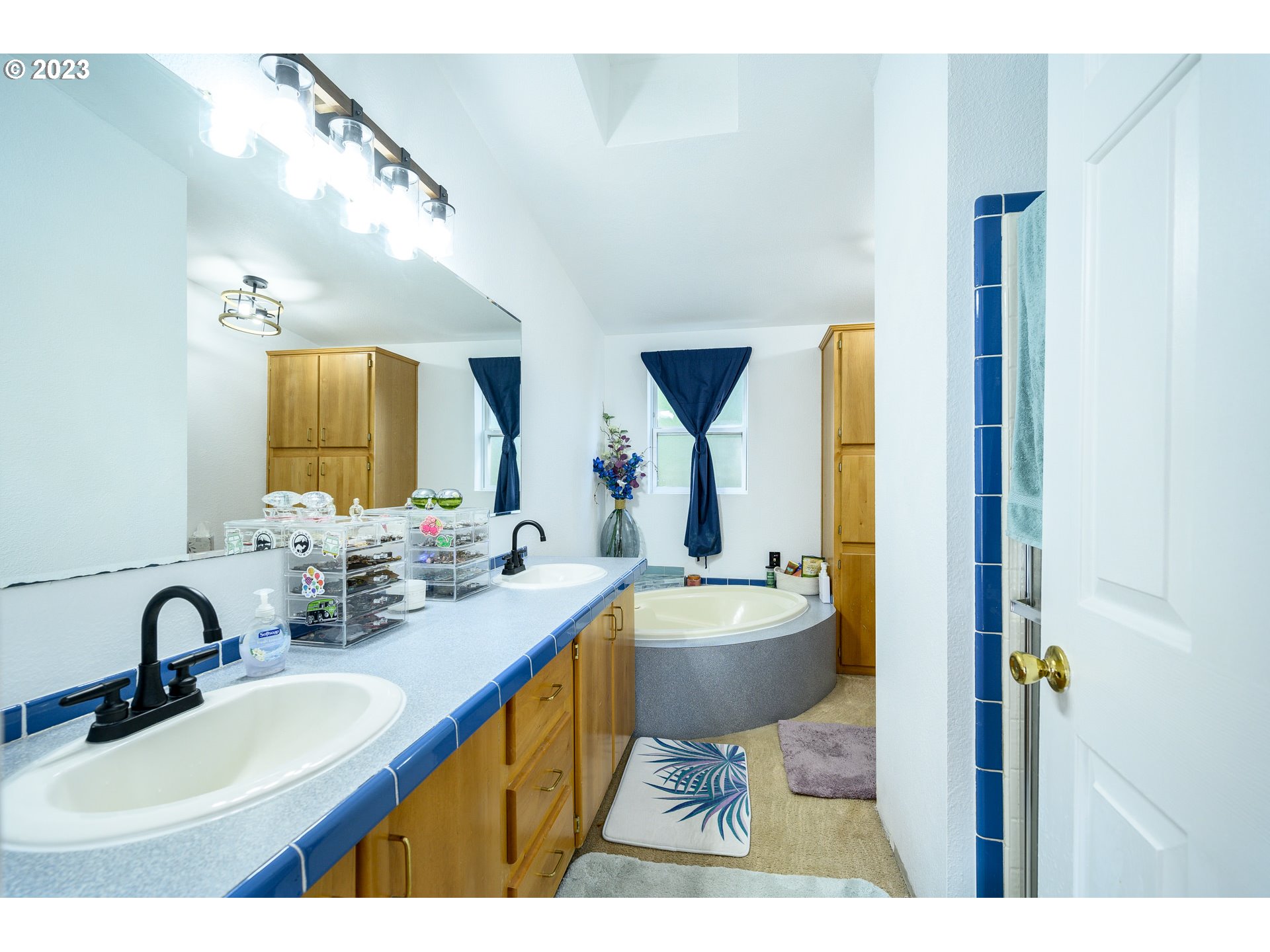 22575 Southwest Grand Ronde Road Grand Ronde, OR 97347 - Photo 26 of 46 a bathroom with a sink and a mirror