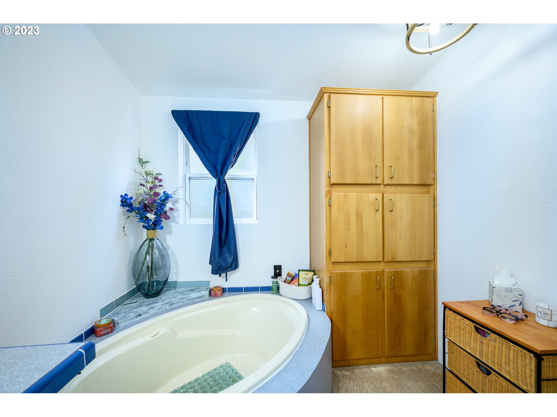 22575 Southwest Grand Ronde Road Grand Ronde, OR 97347 - Photo 27 of 46 a bathroom with a tub and a sink