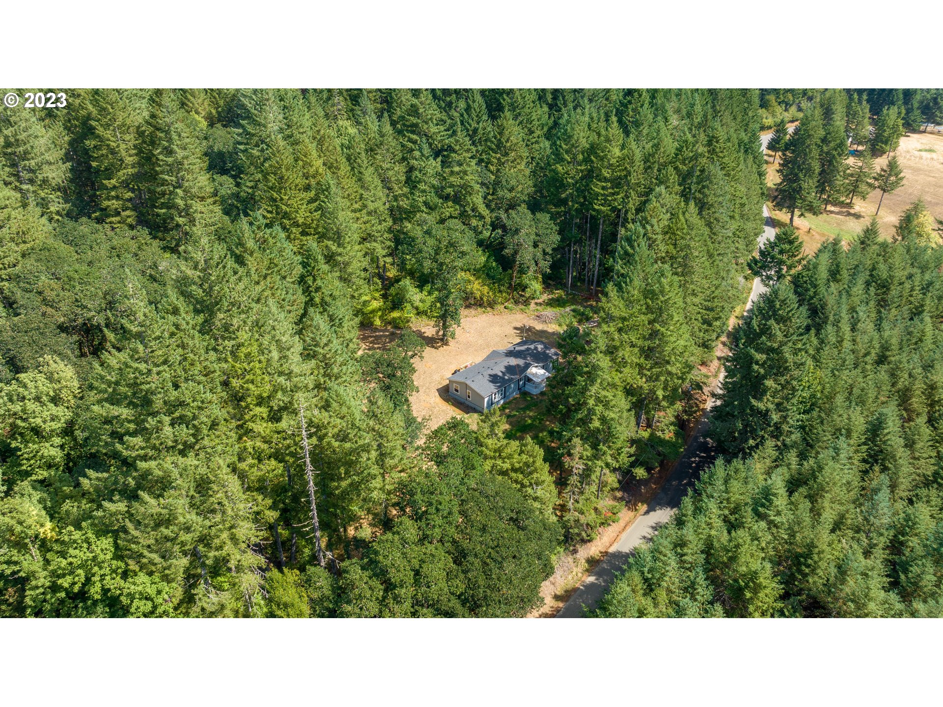 22575 Southwest Grand Ronde Road Grand Ronde, OR 97347 - Photo 3 of 46 a open area of a house with a yard