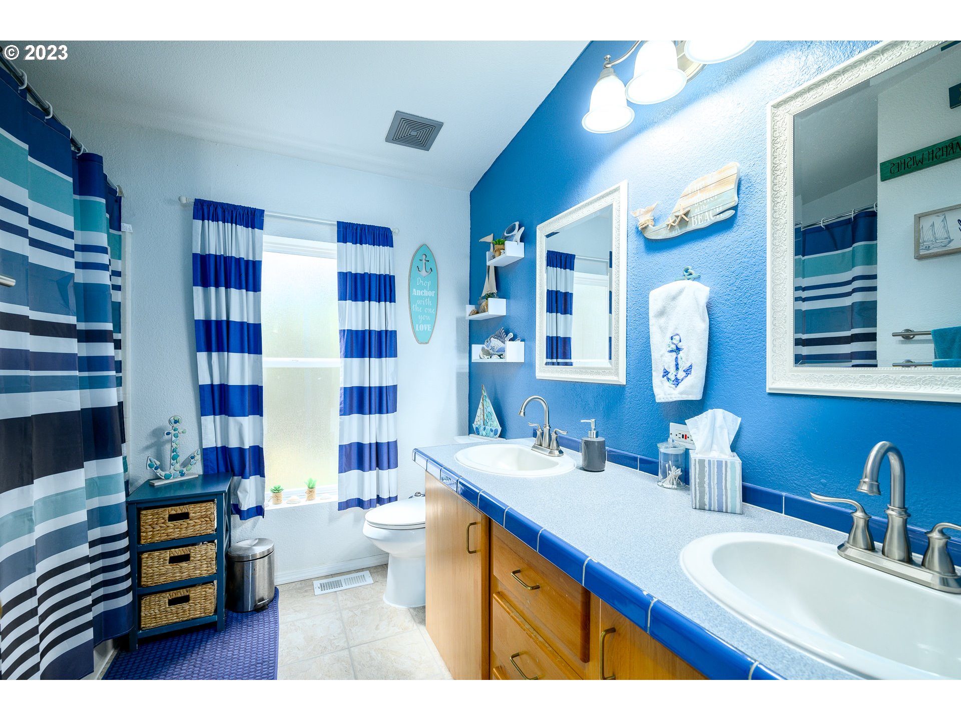 22575 Southwest Grand Ronde Road Grand Ronde, OR 97347 - Photo 33 of 46 a bathroom with a sink double vanity and shower