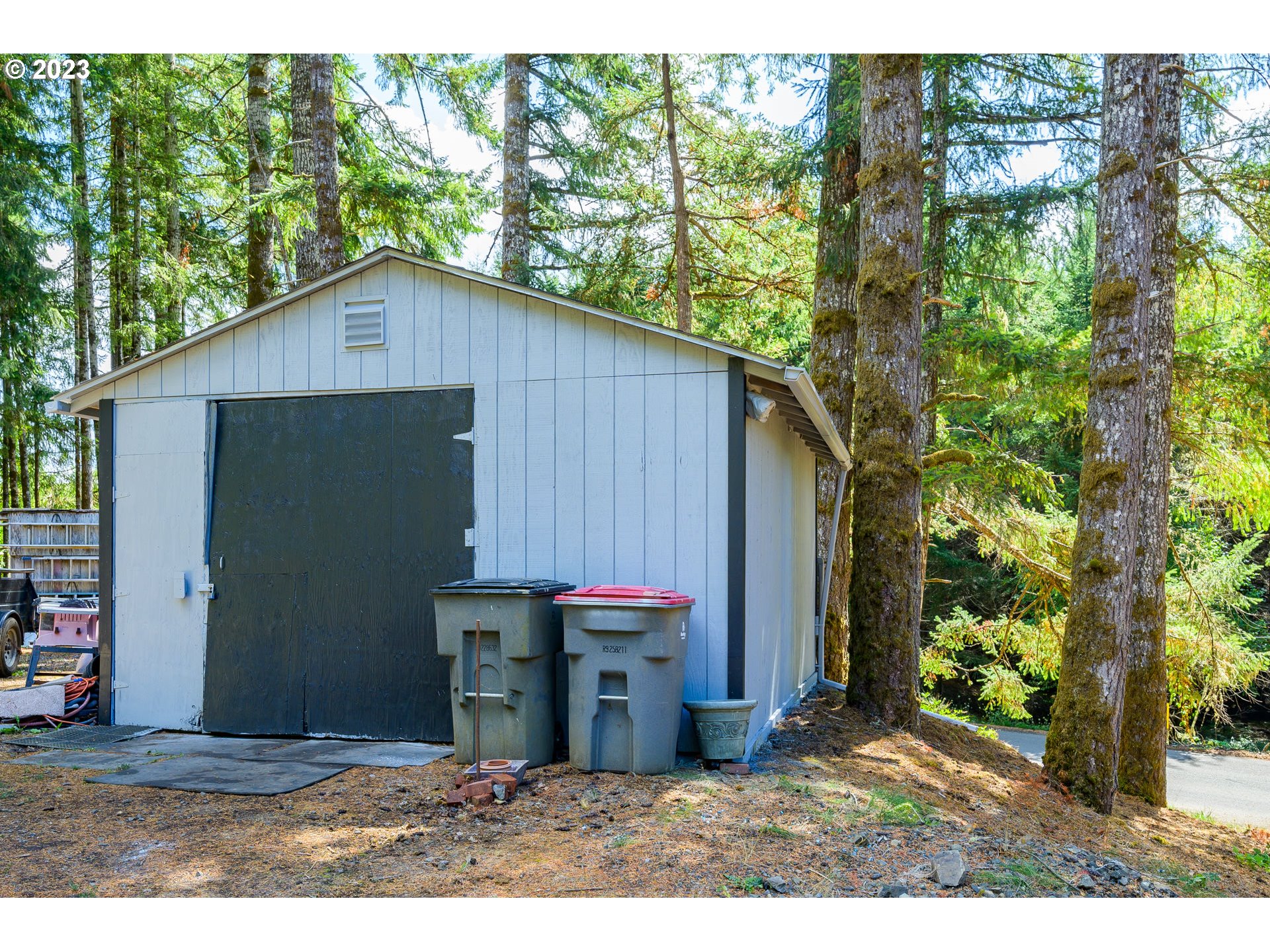 22575 Southwest Grand Ronde Road Grand Ronde, OR 97347 - Photo 40 of 46 a backyard of a house with barbeque oven and outdoor seating