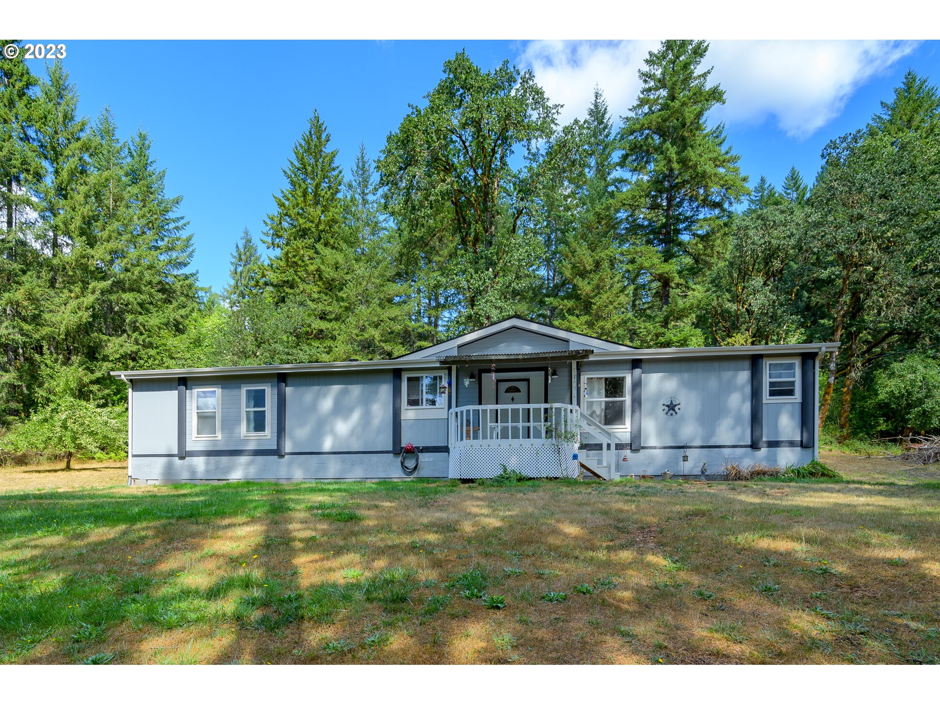 22575 Southwest Grand Ronde Road Grand Ronde, OR 97347 - Photo 7 of 46 a front view of a house with garden