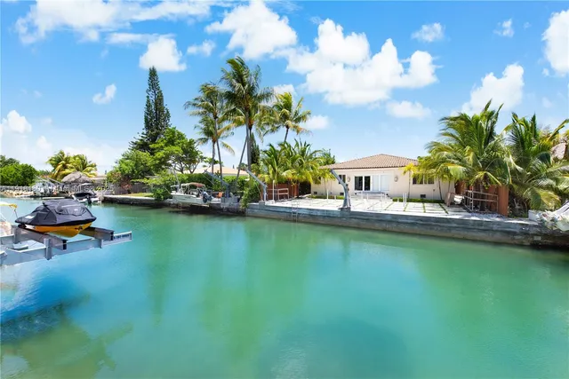 a house view with swimming pool and sitting space