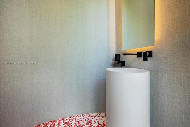 a bedroom with a large bed and a large window