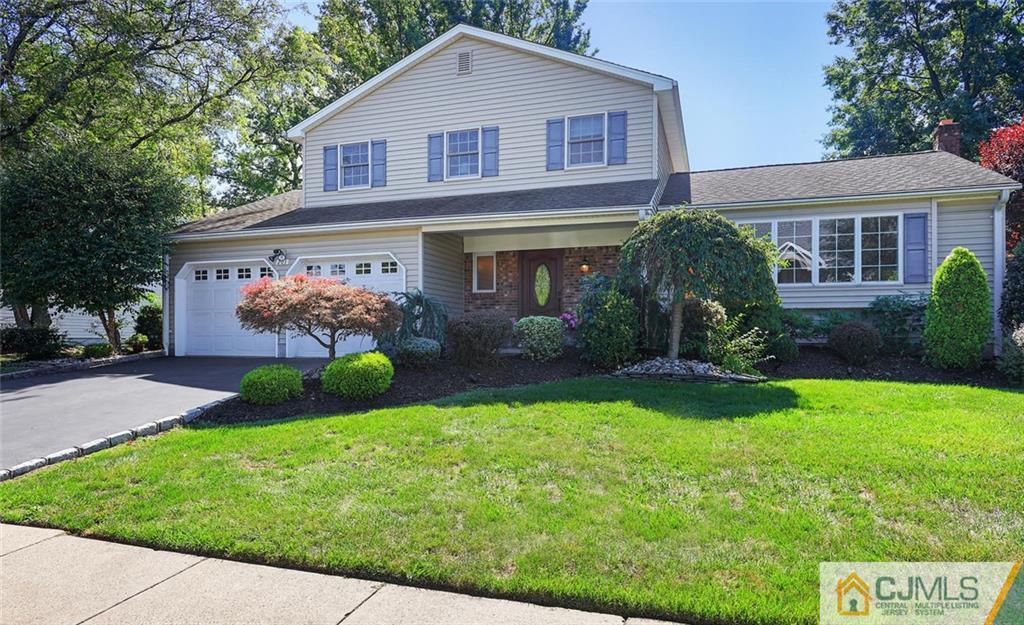 203 Normandy Road Edison, NJ 08820 - Photo 2 of 32 a front view of a house with garden