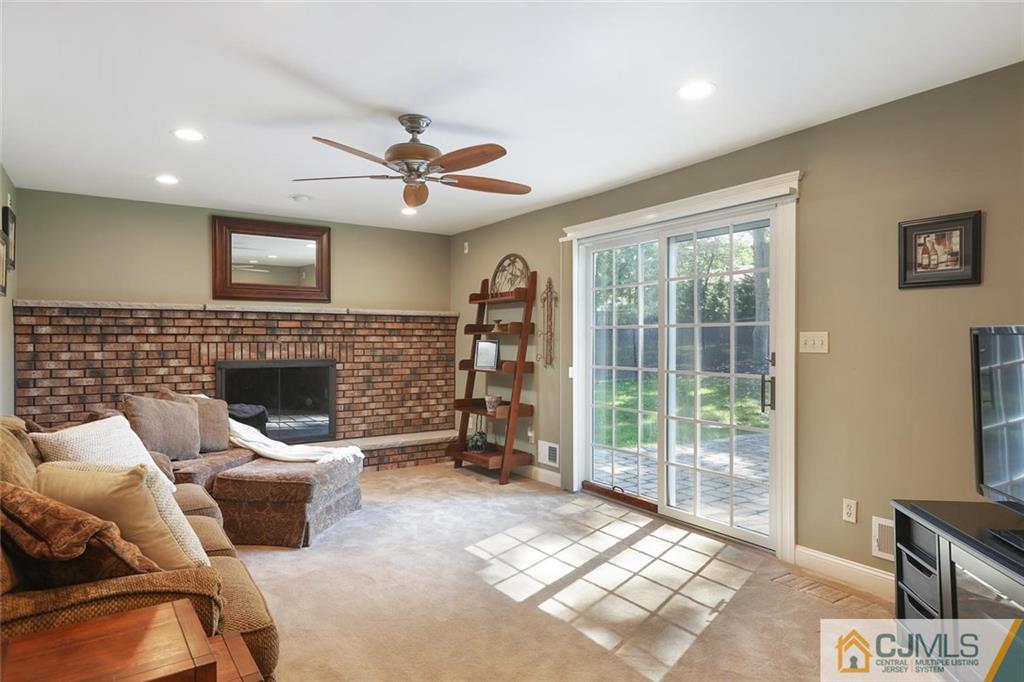 203 Normandy Road Edison, NJ 08820 - Photo 11 of 32 a living room with furniture and a fireplace